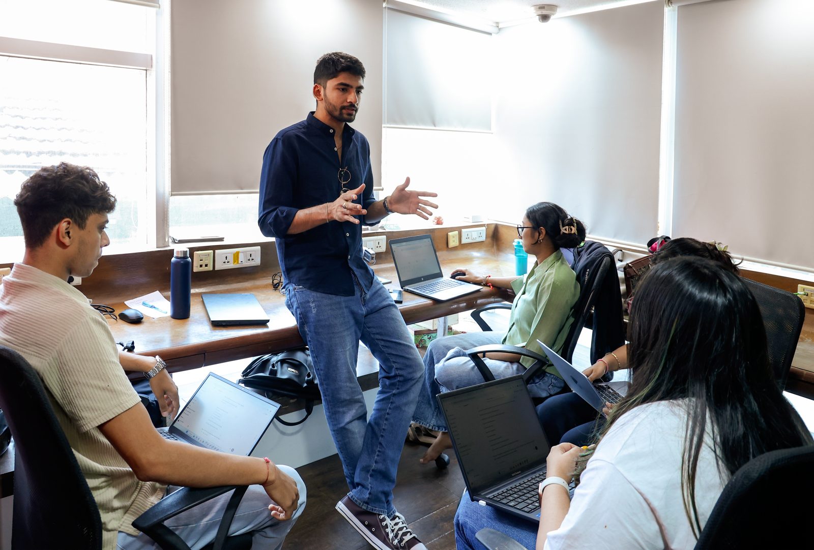 Manan teaching the team in the studio